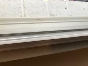 sliding glass door seal between 2 panes of tempered glass
