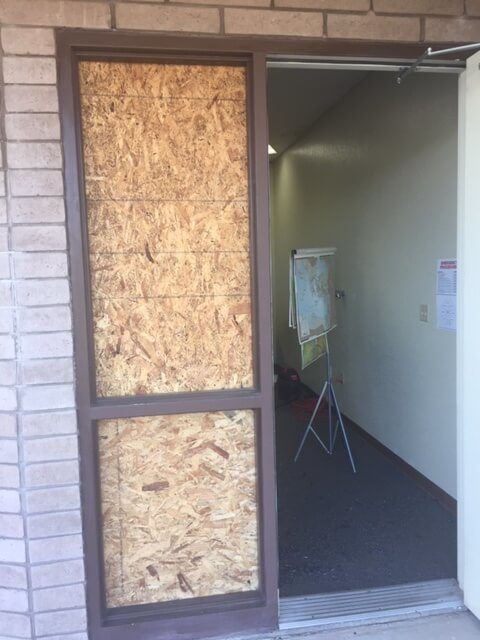 Storefront door needed board up due to break in emergency