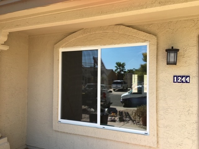 replacement glass in white vinyl window  done by Valleywide Glass