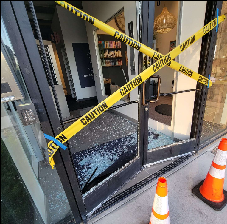 smashed storefront doors by car